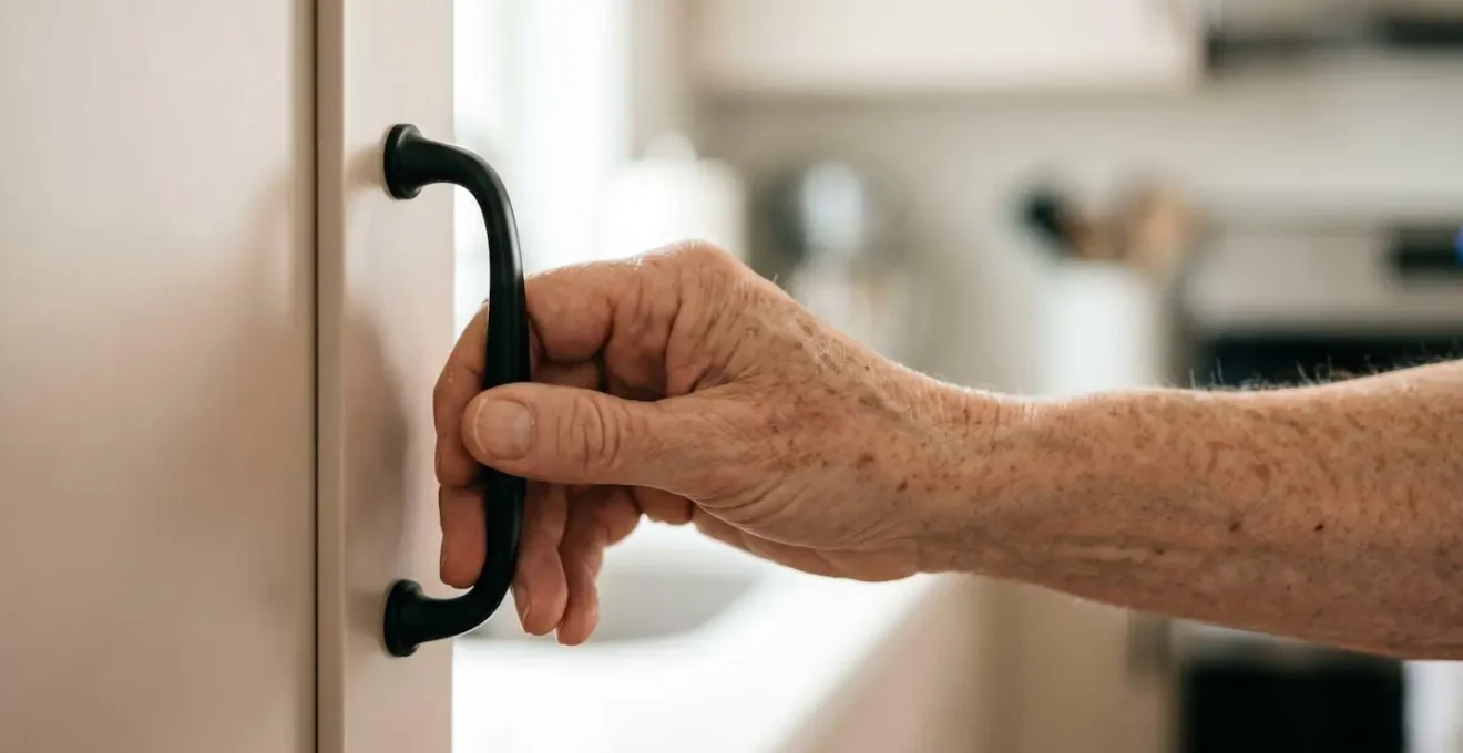 Medium shot of an accessible kitchen featuring ergonomic D-shaped cabinet pulls designed for aging in place