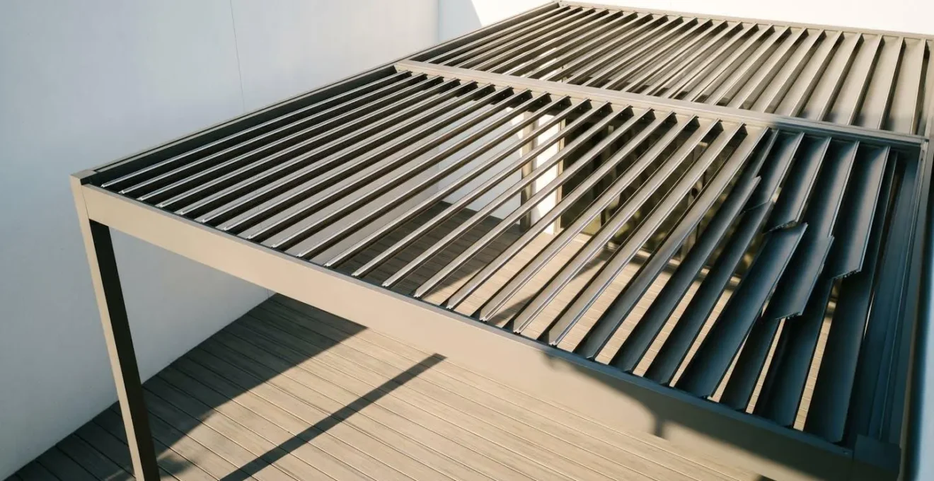 Pergola louver slat orientation showing optimal north-south alignment for blocking east-west sun movement throughout the day